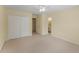 Neutral bedroom with plush carpeting, featuring a double door closet and ensuite bathroom access at 2026 Cresthaven Walk, Woodstock, GA 30189