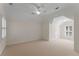 Spacious bedroom with vaulted ceilings, carpet flooring, and a large window for natural light at 2026 Cresthaven Walk, Woodstock, GA 30189