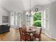 Bright and sunny breakfast nook with backyard views and wood flooring at 2026 Cresthaven Walk, Woodstock, GA 30189