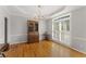 Elegant dining room with hardwood floors, chandelier, and decorative trim, with large windows for natural light at 2026 Cresthaven Walk, Woodstock, GA 30189