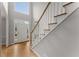Open foyer with hardwood floors, staircase, and lots of natural light at 2026 Cresthaven Walk, Woodstock, GA 30189