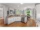 Spacious kitchen with granite countertops, stainless appliances, and natural light at 2026 Cresthaven Walk, Woodstock, GA 30189