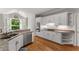 Stylish kitchen with granite countertops, stainless steel appliances, and white cabinets at 2026 Cresthaven Walk, Woodstock, GA 30189