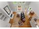 Sun-filled living room with fireplace and open floor plan to dining at 2026 Cresthaven Walk, Woodstock, GA 30189