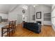 Inviting living room boasts wood floors, fireplace, and built-in shelving at 2026 Cresthaven Walk, Woodstock, GA 30189