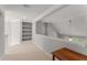 Upstairs loft with built in shelving and sitting area at 2026 Cresthaven Walk, Woodstock, GA 30189