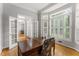 Bright office space with hardwood floors, French doors, large windows with plantation shutters, and a classic desk at 2026 Cresthaven Walk, Woodstock, GA 30189