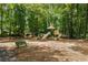 The neighborhood playground offers a fun, safe environment with slides, benches and wood-chip groundcover at 2026 Cresthaven Walk, Woodstock, GA 30189