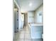 Bright bathroom featuring a tub, tiled floor, and modern fixtures at 238 Marks Rd, Mansfield, GA 30055