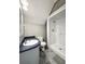 Bright bathroom featuring vanity and white shower with gray floors at 238 Marks Rd, Mansfield, GA 30055