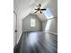 Bedroom with vaulted ceilings, fan, skylight, window, and plank flooring at 238 Marks Rd, Mansfield, GA 30055