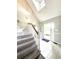 Inviting foyer with a staircase and lots of natural light entering through the front door at 238 Marks Rd, Mansfield, GA 30055
