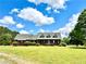 Exterior of house with dormers, and American flag in manicured front yard at 238 Marks Rd, Mansfield, GA 30055