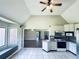 Eat-in kitchen with vaulted ceiling and an island, flowing into a cozy bay window seating area at 238 Marks Rd, Mansfield, GA 30055