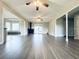 Spacious living room boasts beautiful wood flooring, a fireplace, and natural light at 238 Marks Rd, Mansfield, GA 30055