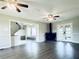 Open concept living room with hardwood floors, fireplace, and glass doors at 238 Marks Rd, Mansfield, GA 30055
