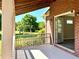 Covered porch with access to the interior and views of the backyard playset and lawn at 238 Marks Rd, Mansfield, GA 30055