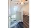 View down staircase featuring neutral walls and contrasting flooring at 238 Marks Rd, Mansfield, GA 30055