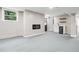Finished basement featuring a modern fireplace, a wet bar, and painted walls at 2771 Smithsonia Way, Tucker, GA 30084