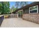 Relaxing deck with wood flooring and railing offers outdoor living space at 2771 Smithsonia Way, Tucker, GA 30084