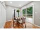Cozy dining area with a wooden table and chairs, leading to an outdoor deck with backyard views at 2771 Smithsonia Way, Tucker, GA 30084