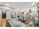 Open concept living room features hardwood floors, recessed lighting, and modern furnishings at 2771 Smithsonia Way, Tucker, GA 30084