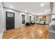 Bright living and dining area featuring hardwood floors, stylish furniture, and ample natural light at 2771 Smithsonia Way, Tucker, GA 30084