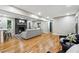 Open-concept living area with fireplace, bar seating, and hardwood floors at 2771 Smithsonia Way, Tucker, GA 30084