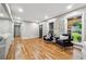 Spacious living area featuring hardwood floors, natural light, and stylish decor at 2771 Smithsonia Way, Tucker, GA 30084