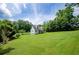 Secluded home with a huge backyard lined with trees, creating a private outdoor retreat at 410 Hendon Rd, Woodstock, GA 30188