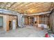 Unfinished basement with exposed ductwork, insulation, and a water heater offers potential for customization at 410 Hendon Rd, Woodstock, GA 30188