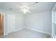 Neutral bedroom featuring plush gray carpeting and large windows for plenty of natural light at 410 Hendon Rd, Woodstock, GA 30188