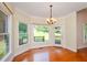 Charming breakfast nook with hardwood floors, large windows, and a view of the deck at 410 Hendon Rd, Woodstock, GA 30188