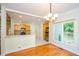 Open dining area with hardwood floors, natural light, and access to the kitchen at 410 Hendon Rd, Woodstock, GA 30188