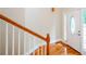 Bright entryway showcasing hardwood floors, a staircase, and a door with decorative glass, creating a welcoming ambiance at 410 Hendon Rd, Woodstock, GA 30188