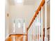Welcoming foyer with beautiful hardwood floors, a decorative door, and a staircase leading to the upper level at 410 Hendon Rd, Woodstock, GA 30188