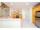 Bright kitchen with wooden cabinets, white countertops, and stainless steel appliances at 410 Hendon Rd, Woodstock, GA 30188
