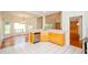 Bright kitchen with wooden cabinets, white countertops, and stainless steel appliances at 410 Hendon Rd, Woodstock, GA 30188