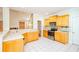 Bright kitchen with wooden cabinets, white countertops, and stainless steel appliances at 410 Hendon Rd, Woodstock, GA 30188