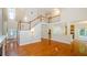 Spacious living room with hardwood floors, staircase, and open access to the kitchen at 410 Hendon Rd, Woodstock, GA 30188