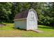 Outbuilding with double doors and a ramp, perfect for storage or hobbies in a private setting at 410 Hendon Rd, Woodstock, GA 30188
