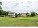 Wide backyard with a shed and partial fencing at 8553 Braylen Manor Dr, Douglasville, GA 30134