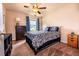 Bedroom with a ceiling fan, window, and a bed with blue patterned bedding at 8553 Braylen Manor Dr, Douglasville, GA 30134