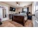 Cozy bedroom with wood-look floors, a mounted TV, and modern decor at 8553 Braylen Manor Dr, Douglasville, GA 30134
