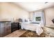 Cozy bedroom with neutral tones, plush bedding, and ample natural light for a serene retreat at 8553 Braylen Manor Dr, Douglasville, GA 30134