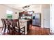 Contemporary kitchen boasts dark wood cabinetry, stainless steel appliances, granite countertops, and a breakfast bar at 8553 Braylen Manor Dr, Douglasville, GA 30134