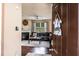 Inviting living room with hardwood floors, fireplace, and view of the sofa through the open doorway at 8553 Braylen Manor Dr, Douglasville, GA 30134
