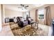 Spacious bedroom featuring comfortable seating, two windows, plush carpet, and a relaxing ambiance at 8553 Braylen Manor Dr, Douglasville, GA 30134