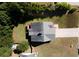 Aerial view of a well-maintained house with a large roof and a spacious, green lawn at 10074 Tara Glynn Dr, Hampton, GA 30228