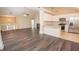 Bright and open living space, featuring a modern kitchen with stainless appliances and stylish flooring at 10074 Tara Glynn Dr, Hampton, GA 30228